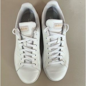 Adidas white tennis shoes.